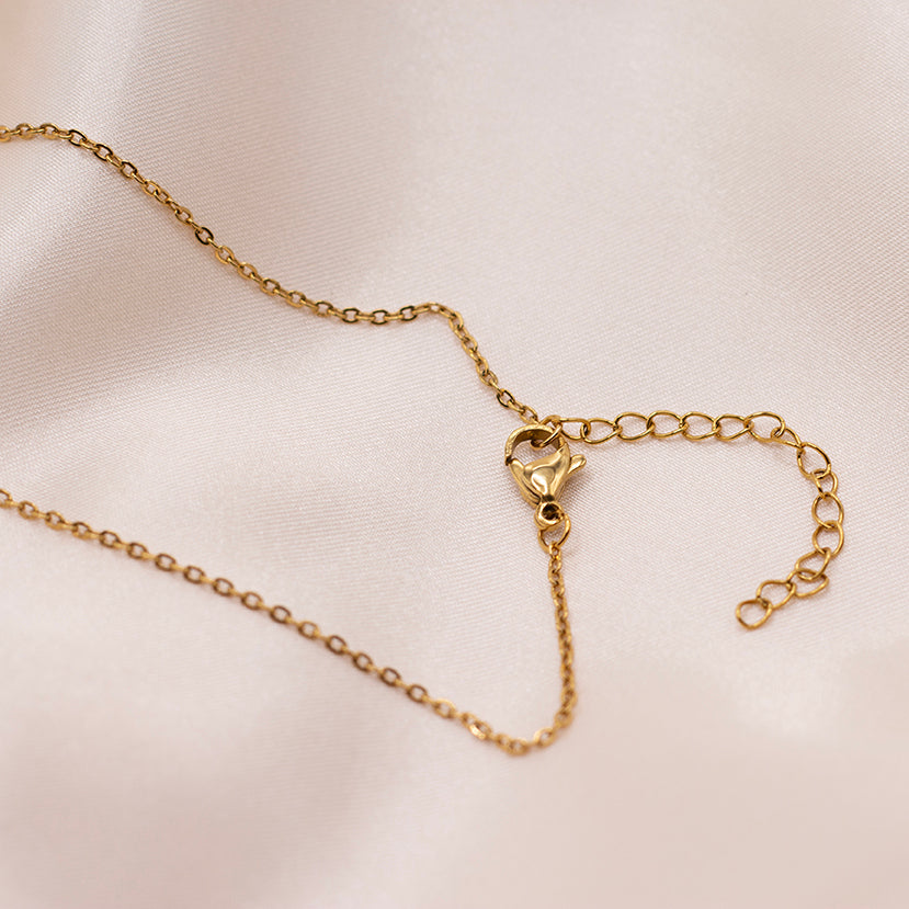 Gold-plated stainless steel chain clasp.