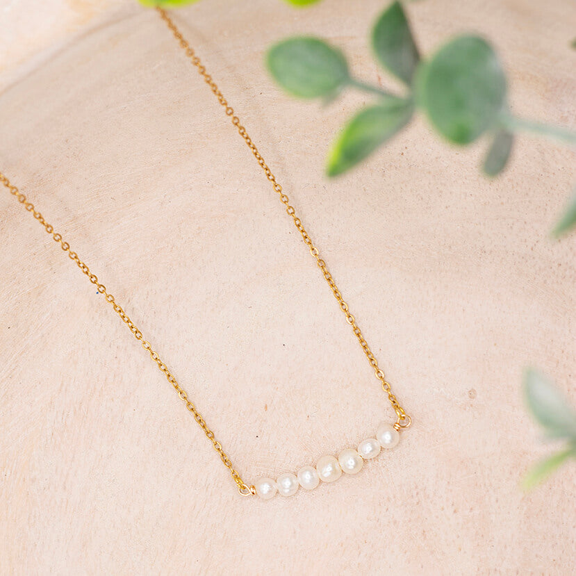 Minimalist, dainty pearl bar necklace with freshwater pearls and gold-plated, stainless steel chain.