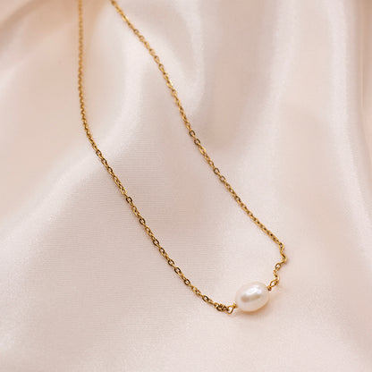 Minimalist pearl necklace with dainty gold plated chain.