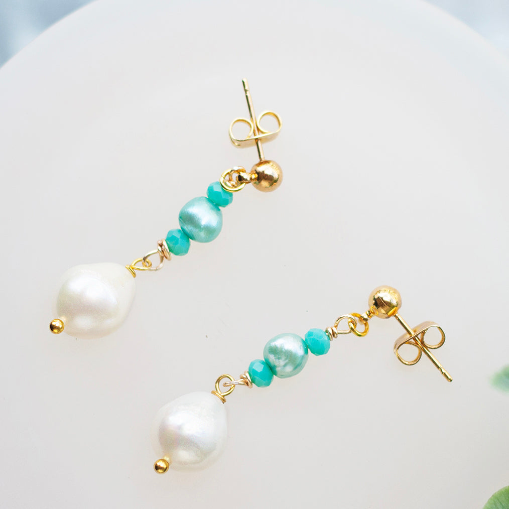 White and Turquoise Pearl Dangle Earrings with freshwater pearls and gold-plated stainless steel posts. Waterproof and hypoallergenic.