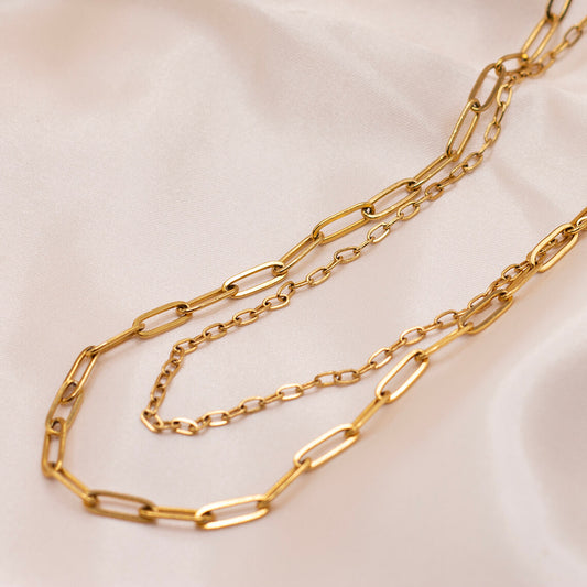 Minimalist double gold paperclip chain made of gold-plated stainless steel.